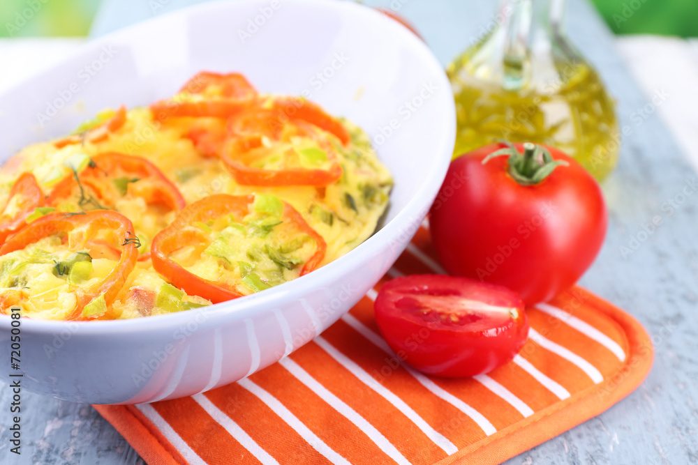 Casserole with vegetables in bowl on natural background Casserole with vegetables in bowl on natural background