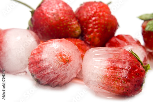 group of strawberry is in ice