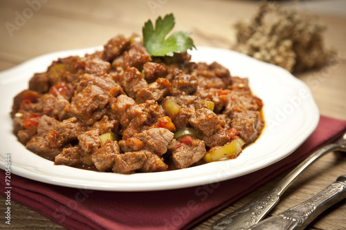 Meat Saute Turkish Et sote with wooden table