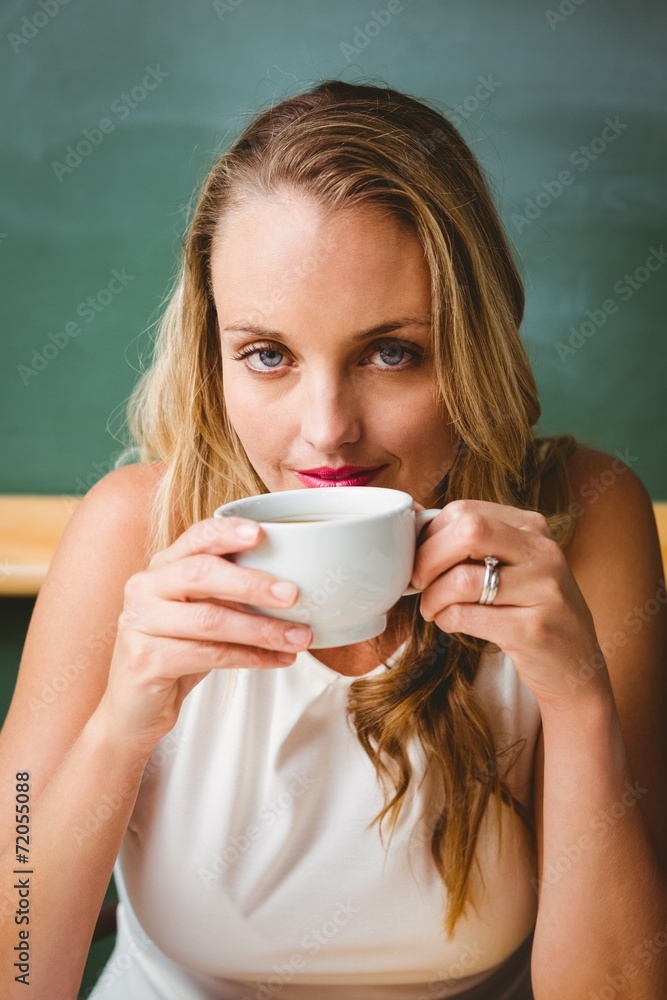 Beautiful businesswoman drinking coffee Beautiful businesswoman drinking coffee