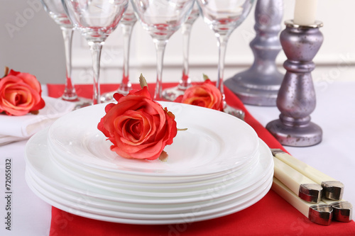 Festive table setting on room background