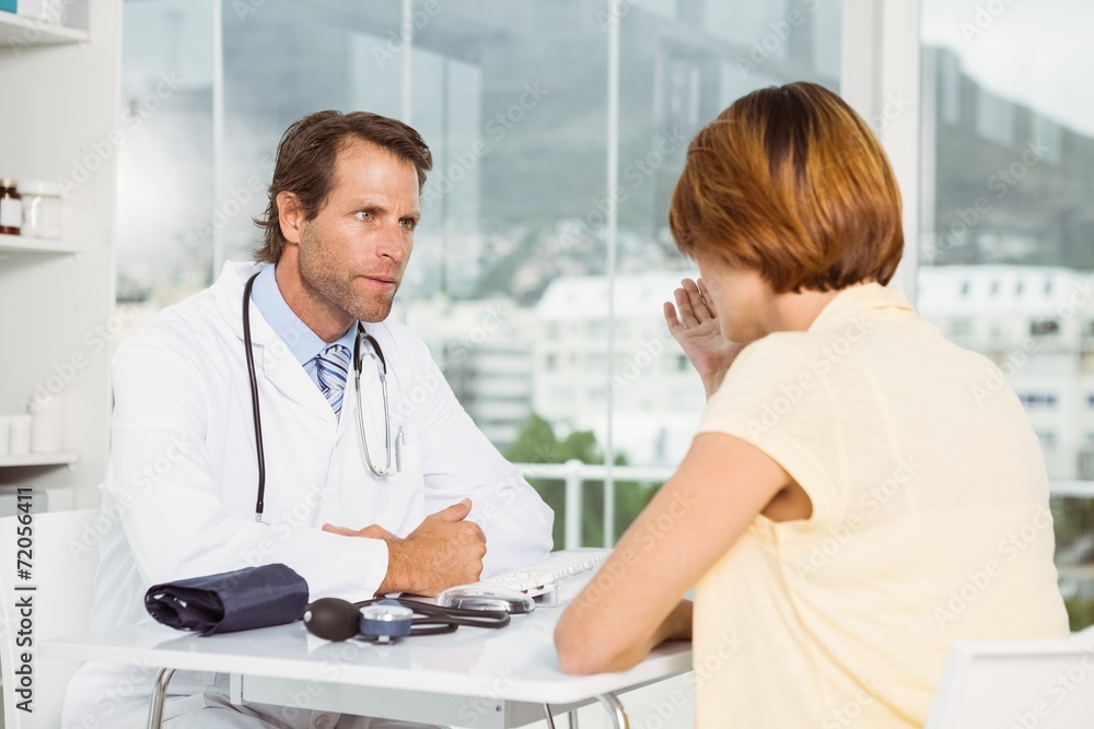 Doctor in discussion with patient at medical office