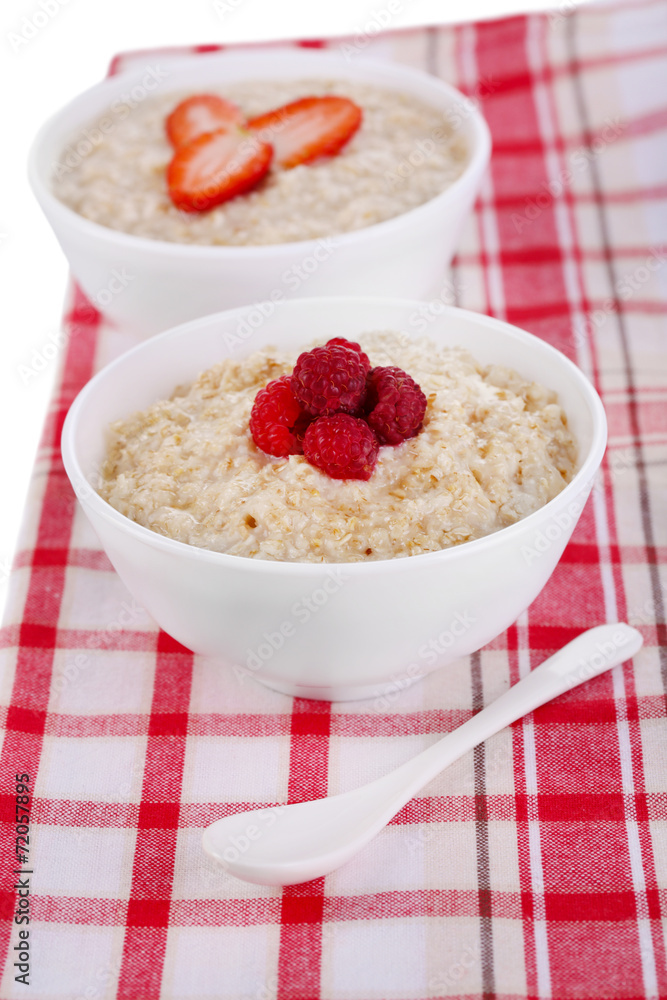 Tasty oatmeal with berries on napkin close-up Tasty oatmeal with berries on napkin close-up