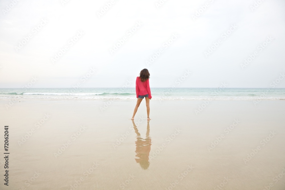 red jersey woman at beach red jersey woman at beach