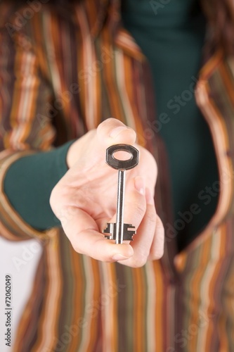 retro key in woman fingers