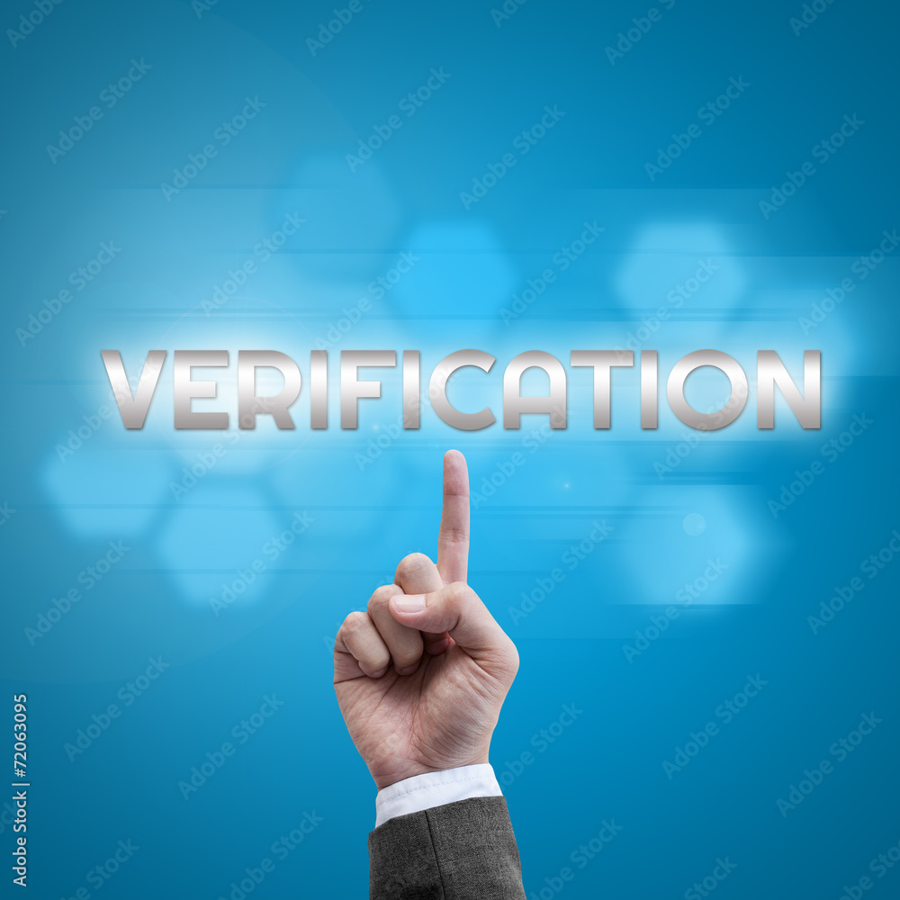 Businessman hand working with modern computer interface as Verif Businessman hand working with modern computer interface as Verif