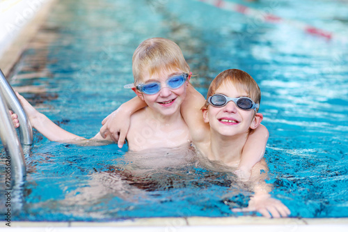 Two boys in swimming pool