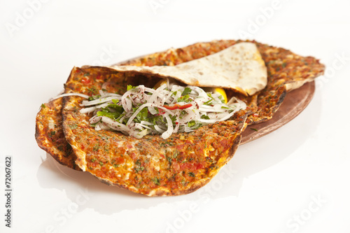 Turkish specialty pizza lahmacun pide with parsley and lemon photo