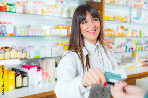Pharmacist suggesting medical drug to buyer in pharmacy drugstor