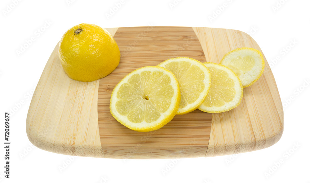 Cut up lemon on cutting board Cut up lemon on cutting board