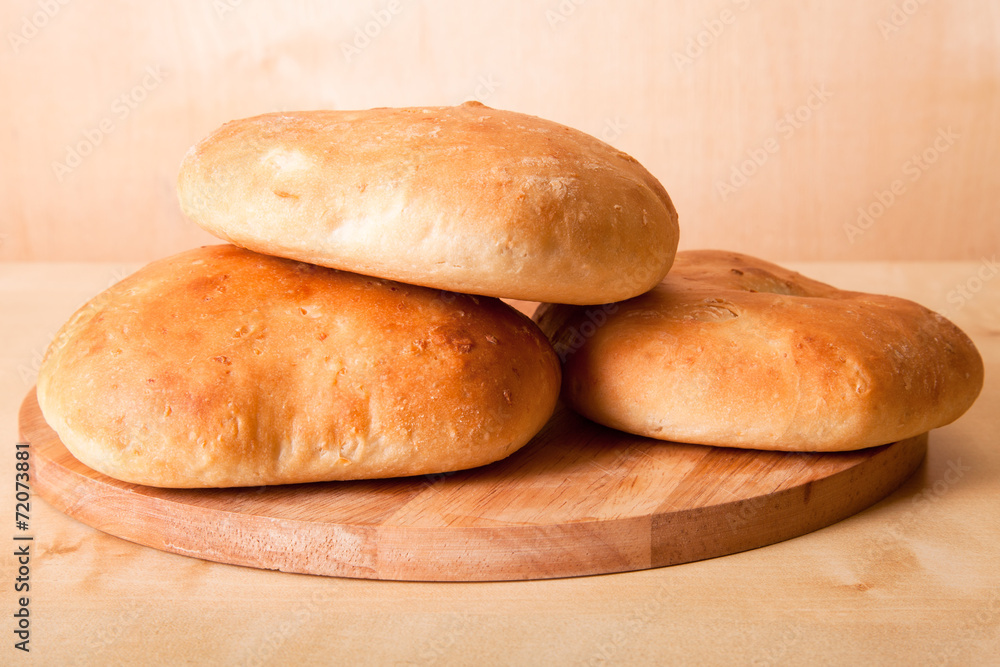 Homemade buns for breakfast on the board. Shallow depth of field Homemade buns for breakfast on the board. Shallow depth of field