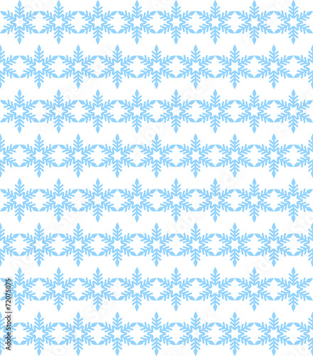Seamless background of blue snowflakes