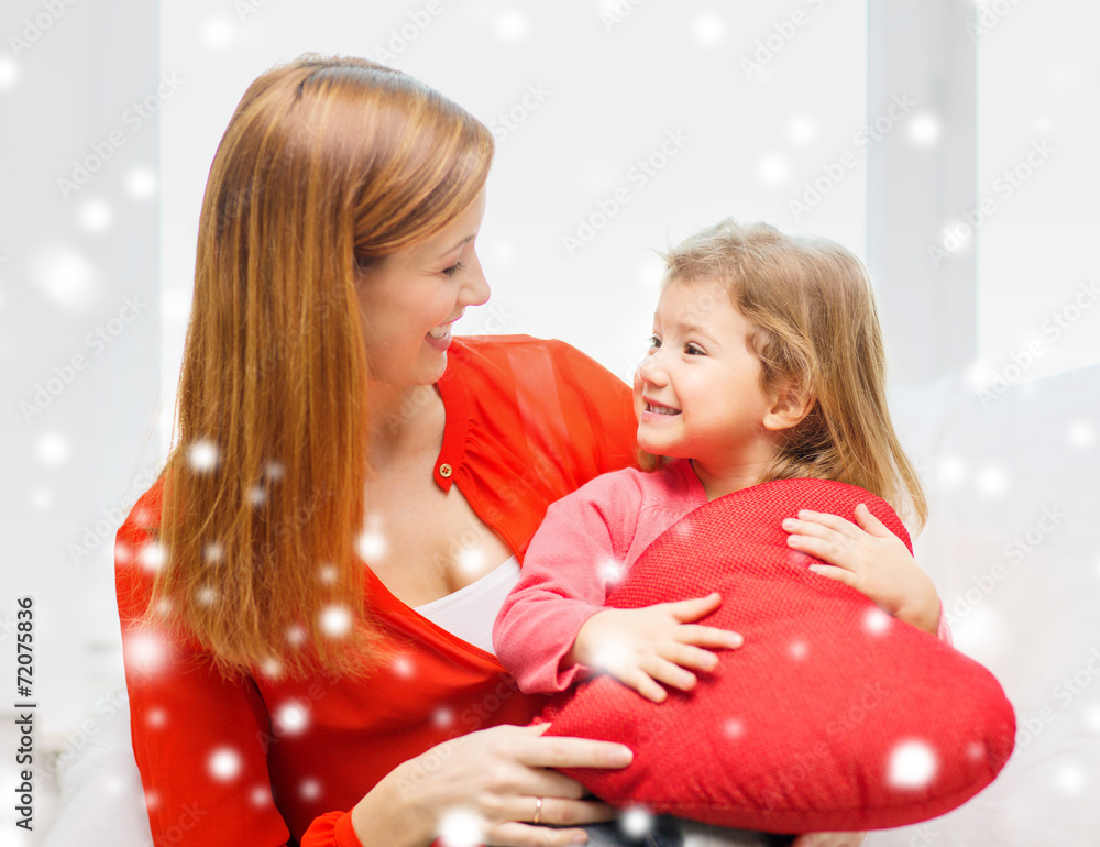 mother and daughter with heart shape pillow mother and daughter with heart shape pillow