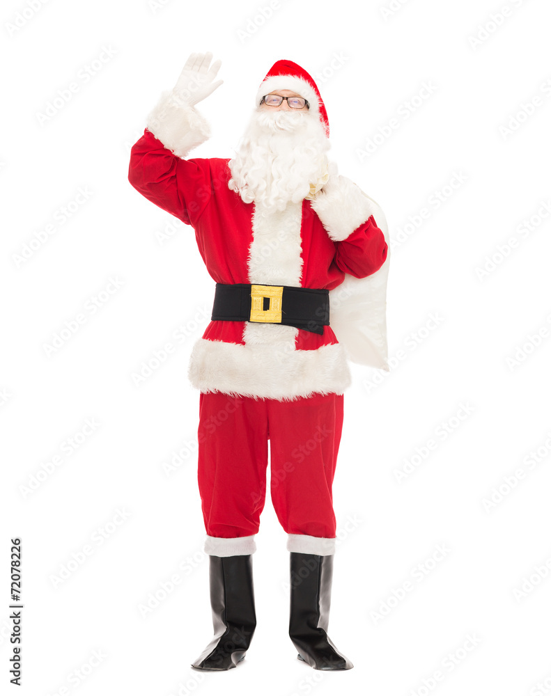 man in costume of santa claus with bag man in costume of santa claus with bag