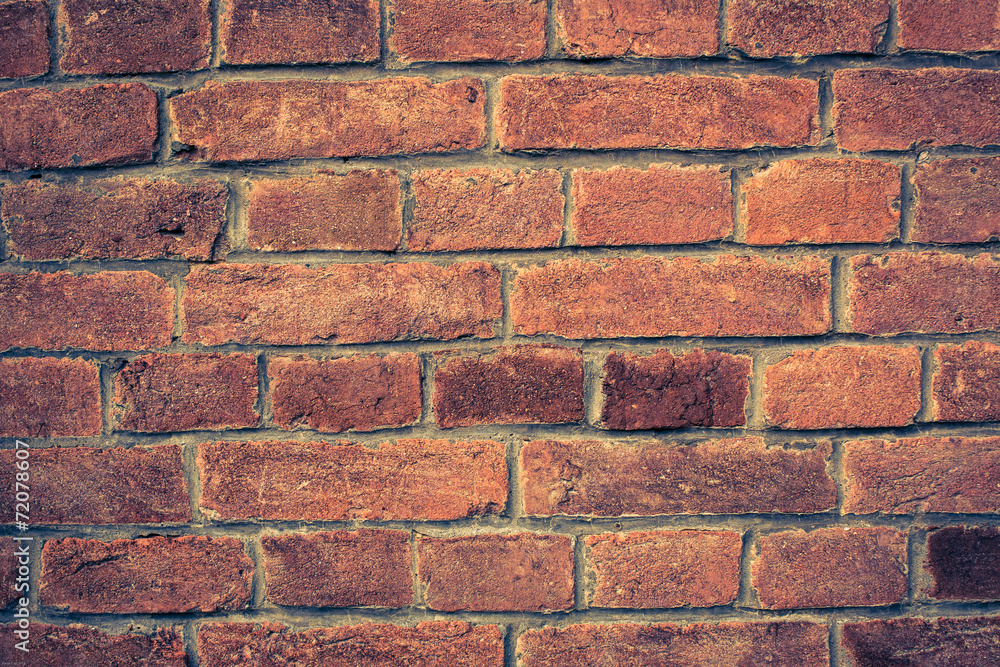 Fototapeta premium Weathered red brick wall background with vignette eccet, grungy