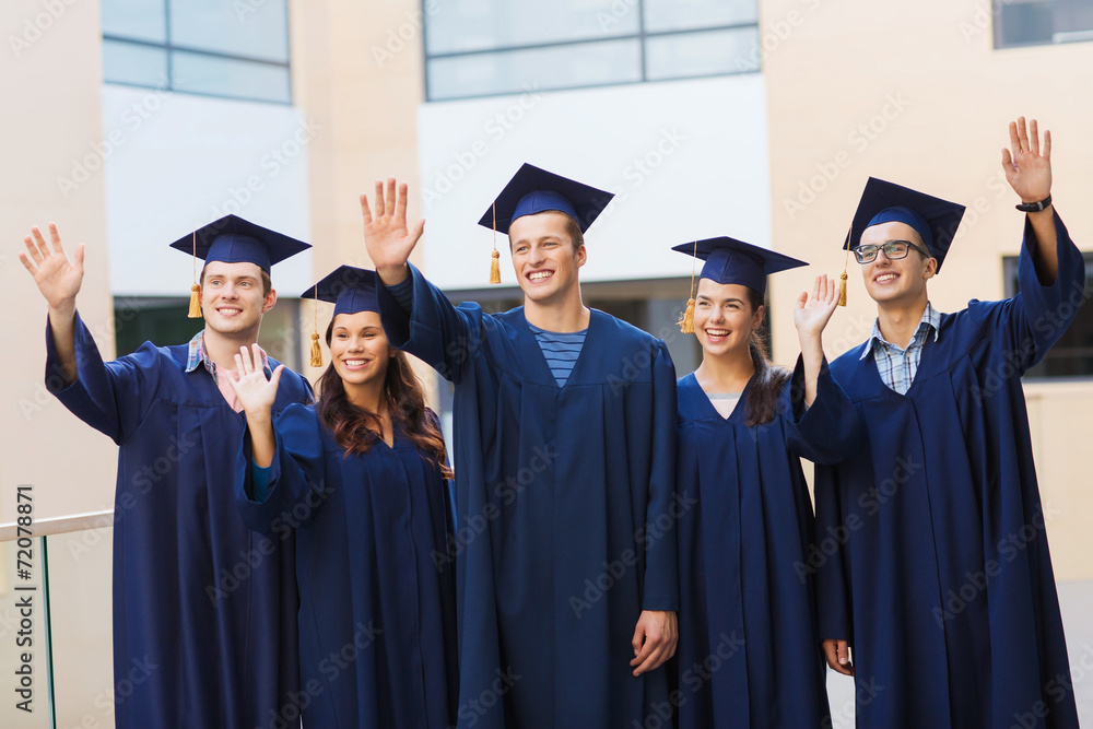 group of smiling students in mortarboards group of smiling students in mortarboards