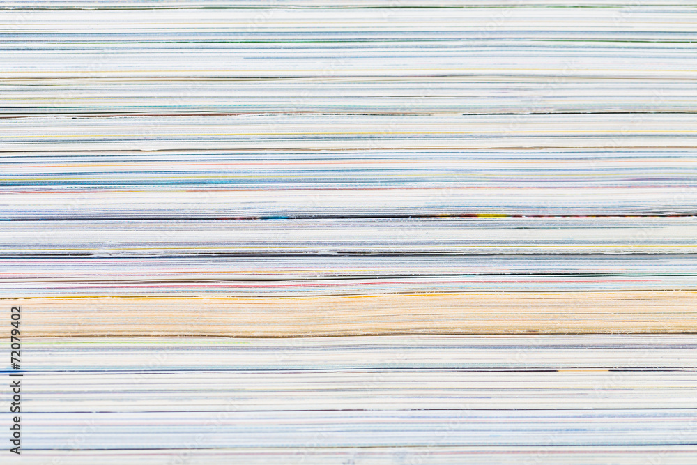 close-ups of stack of colorful magazines close-ups of stack of colorful magazines