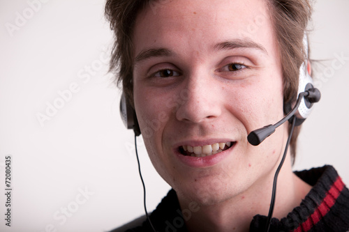 call center young man with a headset photo