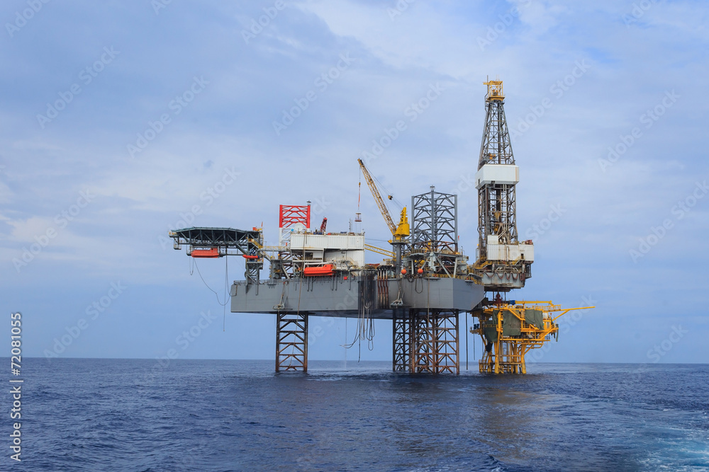 Offshore Jack Up Drilling Rig Over The Production Platform