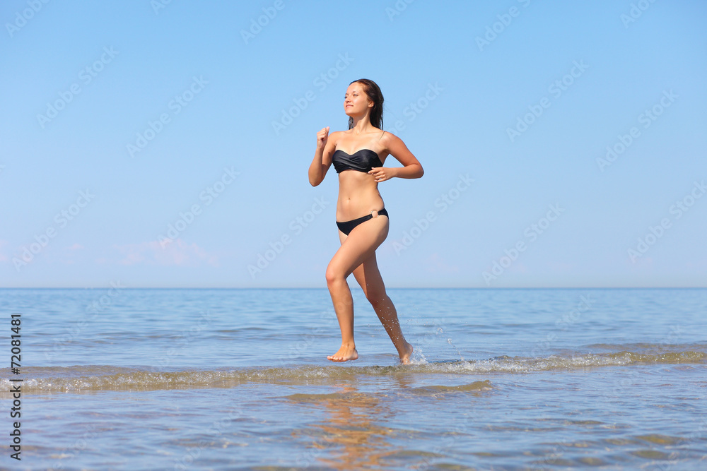 woman running in the water woman running in the water