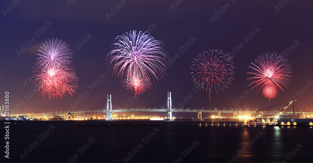 Fototapeta premium Fireworks celebrating over Yokohama Bay Bridge at night