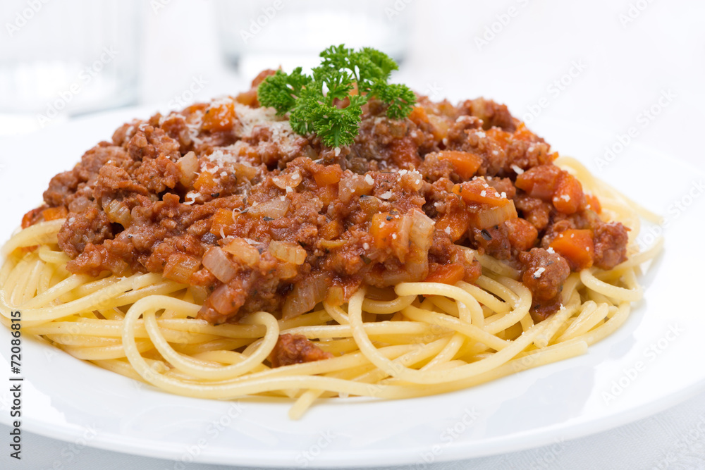 spaghetti bolognese on a white plate, close-up spaghetti bolognese on a white plate, close-up