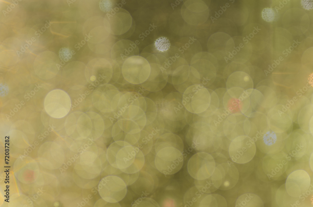 Obraz premium Abstract circular bokeh warm green background