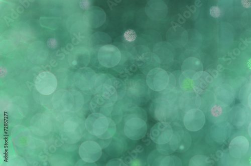 Abstract circular bokeh cold green background