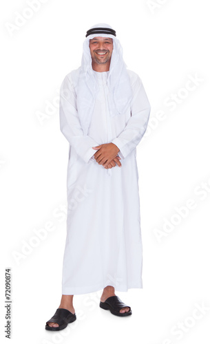 Smiling Arabian Man Standing Over White Background