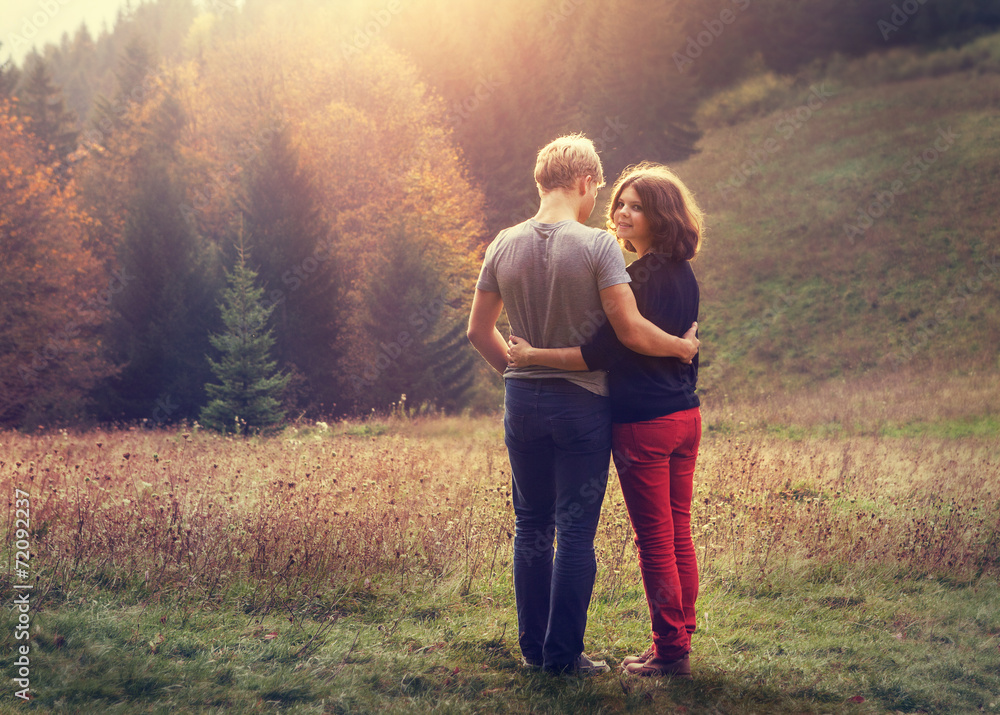 Two inlove young people on the sunset forest glade Two inlove young people on the sunset forest glade