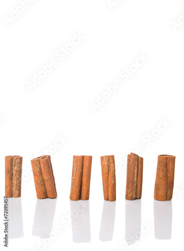 Cinnamon sticks over white background