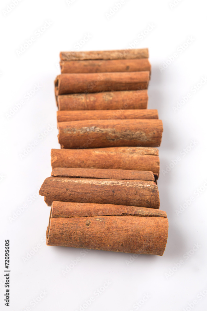 Cinnamon sticks over white background Cinnamon sticks over white background