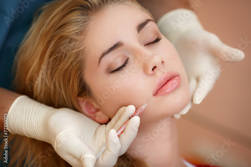 Young woman receiving cosmetic injection