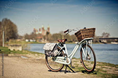 Bild auf Leinwand Bicycle at the Rhine