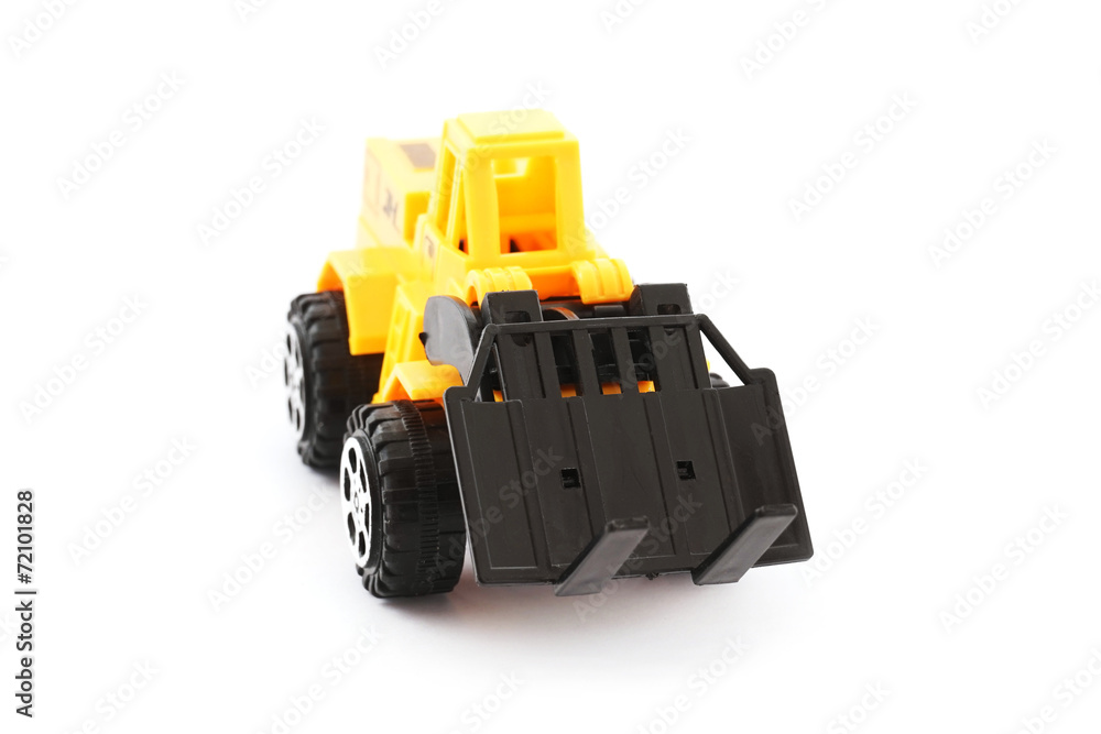 Yellow and black toy forklift on white background