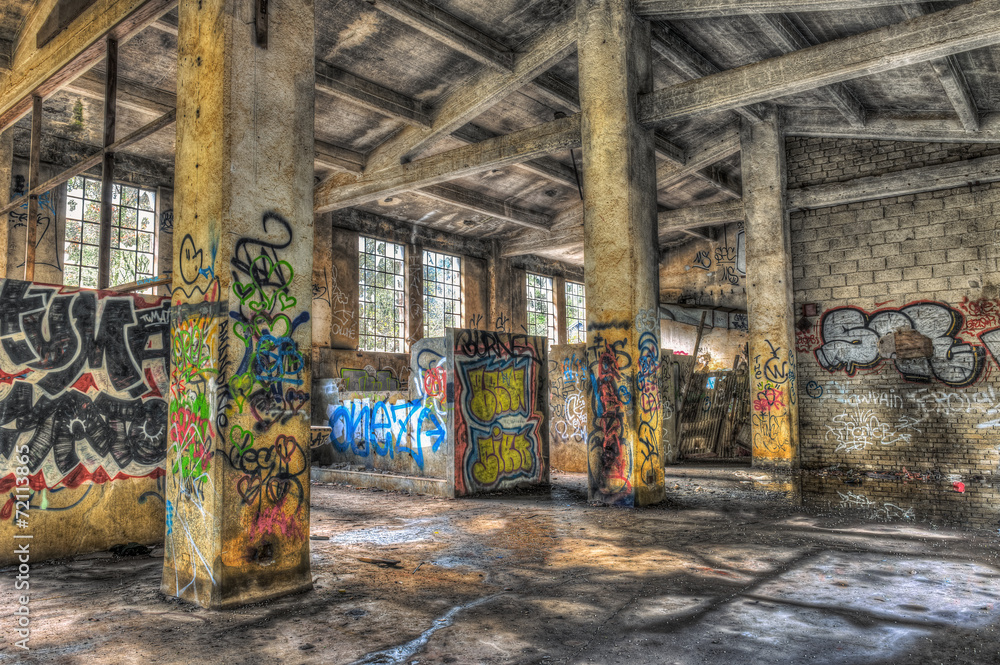 Empty derelict warehouse with concrete pillars Empty derelict warehouse with concrete pillars