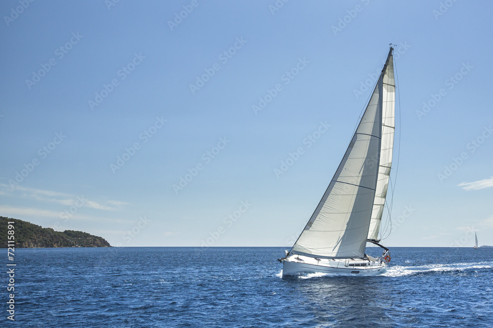 Sailing off the coast in the Aegean Sea. Luxury yachts.