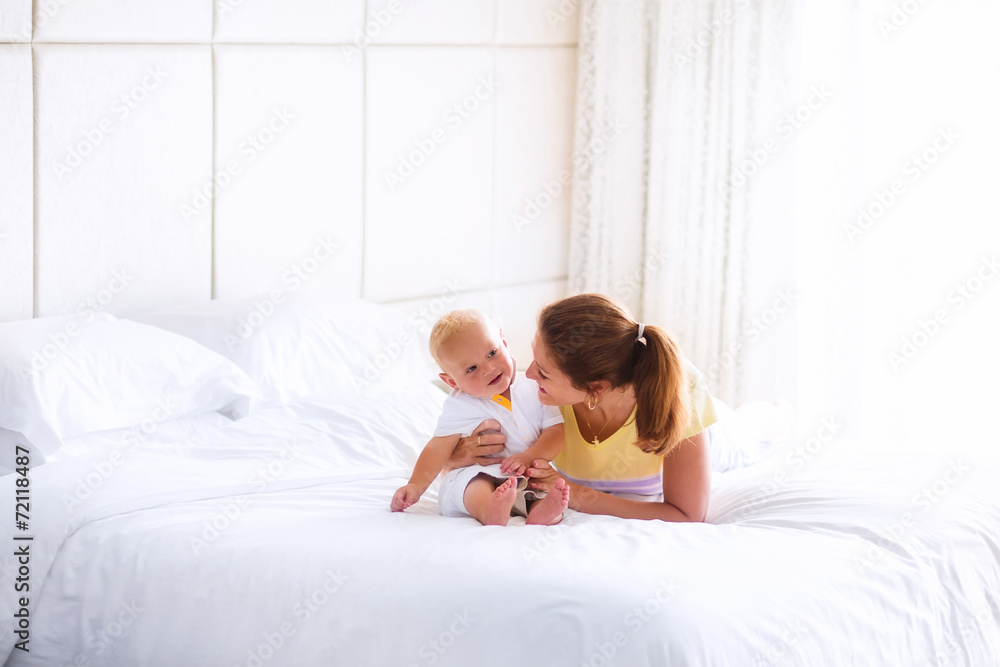 Sweet baby and mother in bed Sweet baby and mother in bed