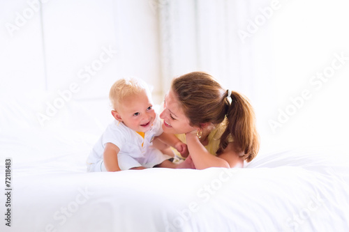 Baby and mother in bed
