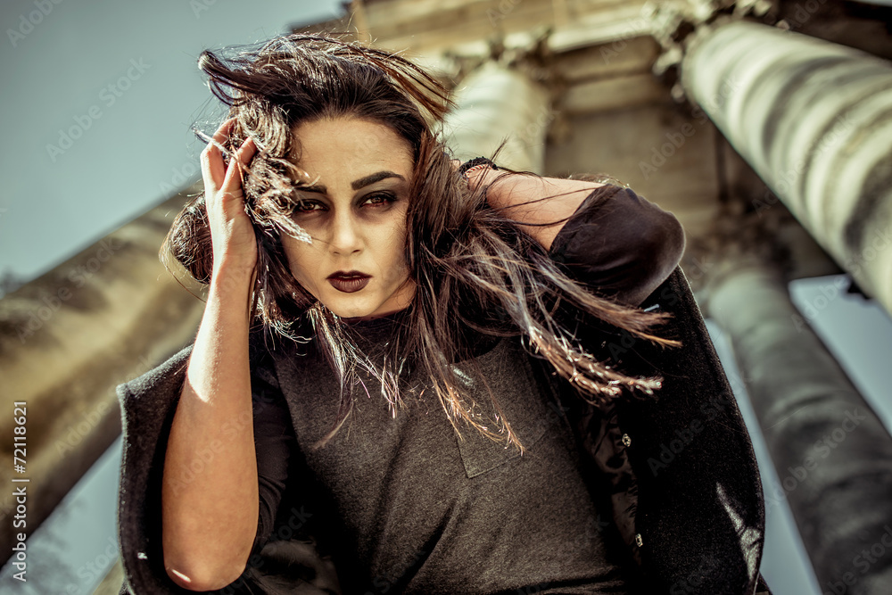 Long hair girl with scary makeup on the old church background Long hair girl with scary makeup on the old church background
