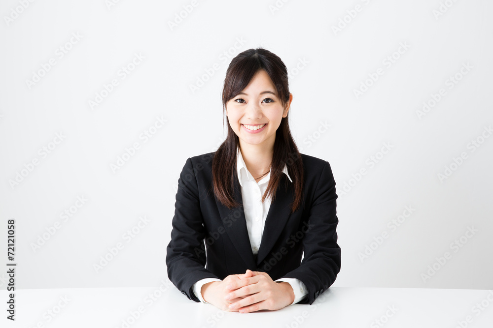 asian businesswoman sitting on the table asian businesswoman sitting on the table