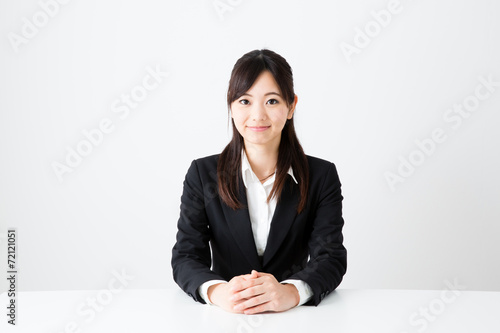 asian businesswoman sitting on the table