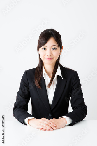 asian businesswoman sitting on the table