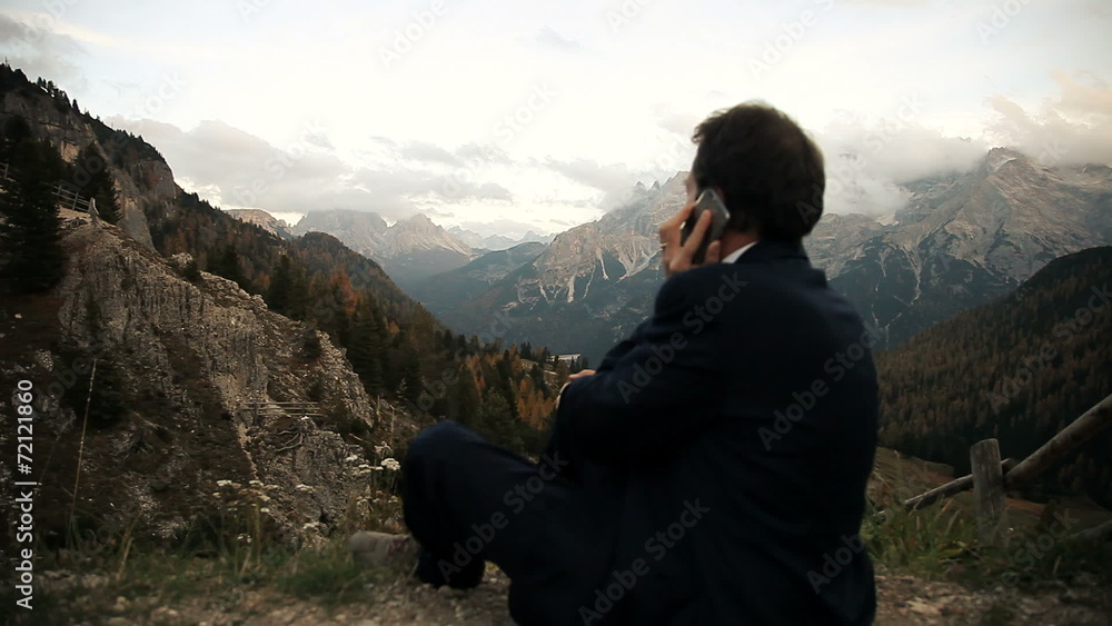 Happy business man on the phone in the mountain Happy business man on the phone in the mountain