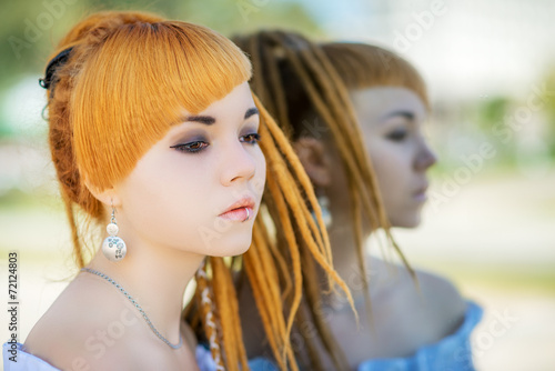 Portrait of asian woman, outdoor. Reflection in the mirror.