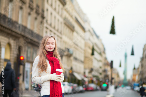 Girl with take away coffee on a Parisian street © Ekaterina Pokrovsky