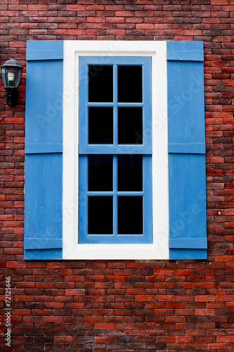 red brick with blue and white window