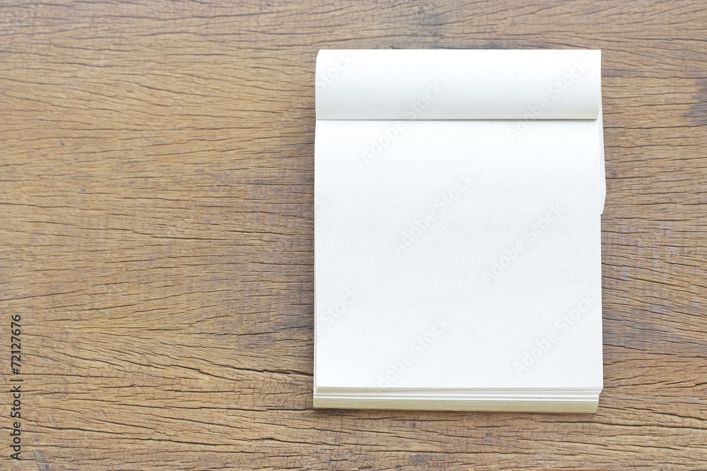 Notebook on wooden table Notebook on wooden table