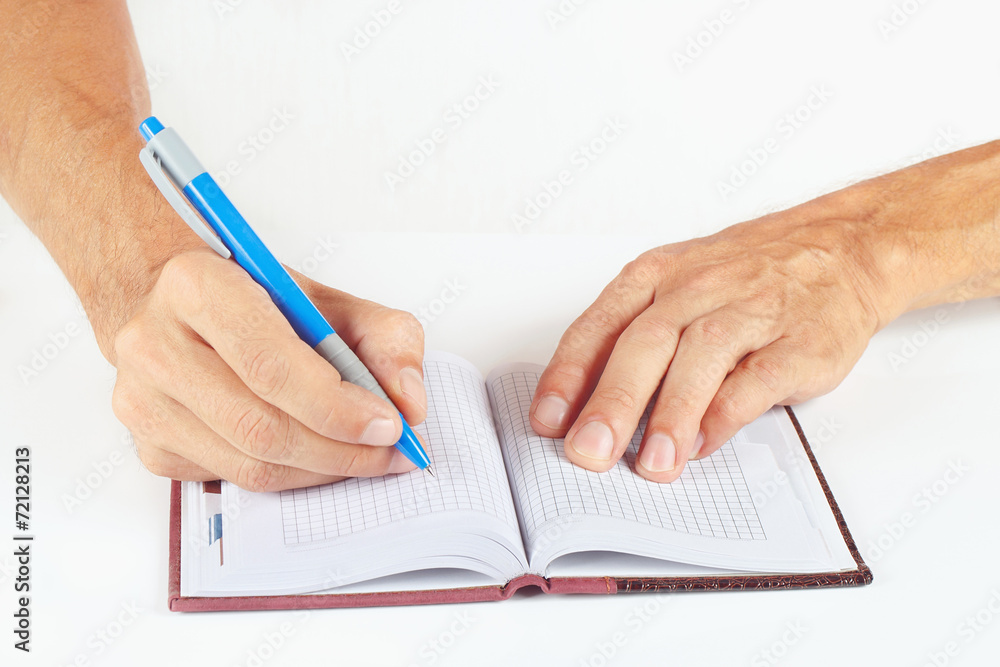 Hand written notes in pen in a notebook on a white background Hand written notes in pen in a notebook on a white background