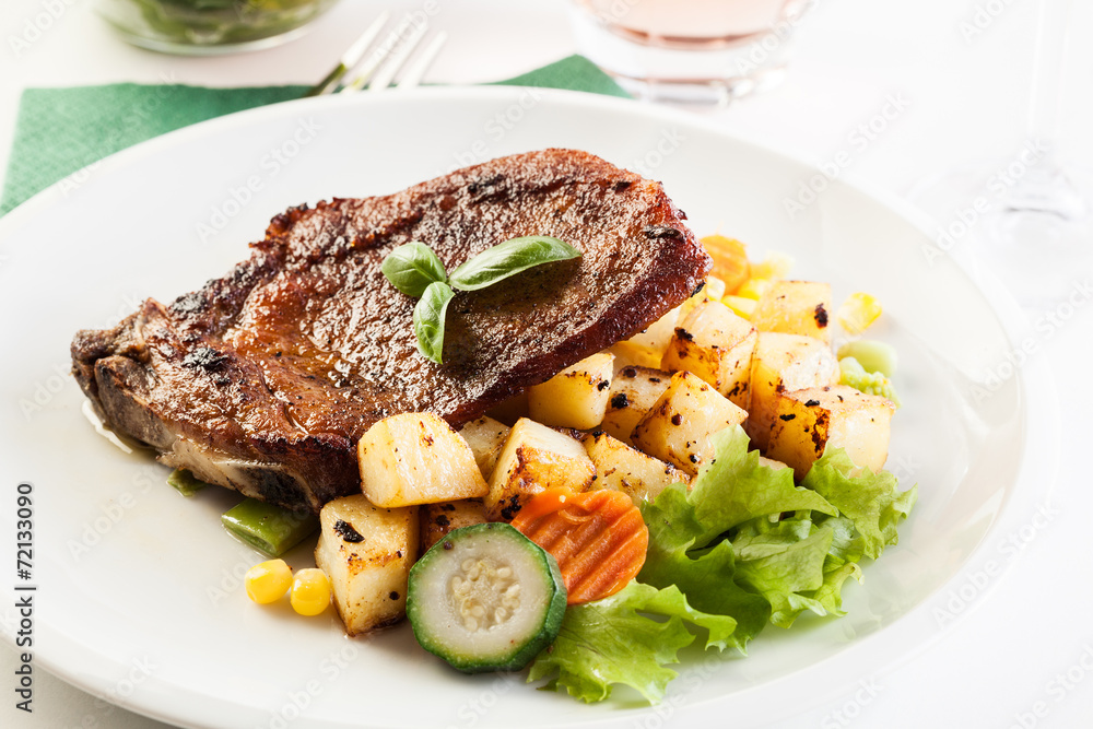 Fried pork with potatoes and vegetables salad Fried pork with potatoes and vegetables salad
